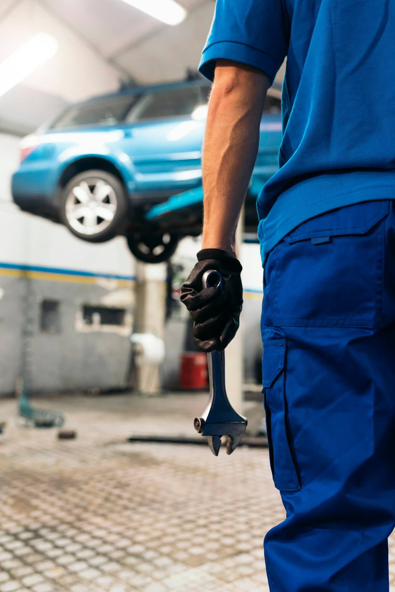 Professional Mechanic Repairing Car Engine.